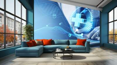 Man typing on laptop, glowing medical icons with AI technologies Wall mural