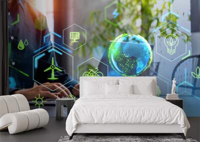 Man with laptop, green energy interface Wall mural