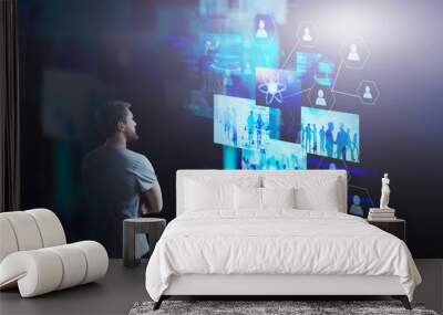 Startup man looking at virtual screens Wall mural