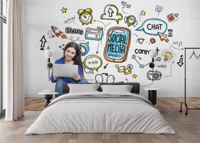 Teenage girl in jeans holding a laptop, social media Wall mural