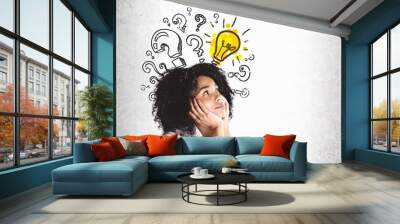 Thoughtful young African woman, questions and idea Wall mural