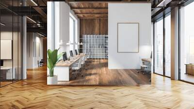 White and wooden office room with mockup blank canvas with computers on tables and white armchairs. Open space business room with bookshelves, wooden wall and floor, 3D rendering no people Wall mural