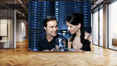 Couple enjoying their meal in a luxurious restaurant Wall mural