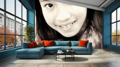 Sepia picture of a girl in jacket smiling at the camera Wall mural