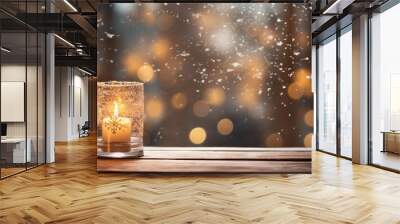 Candle in windowsill against on a background of snowy forest and snow-covered trees outside the window Wall mural