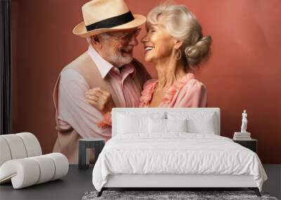 Elderly couple lovingly embracing and smiling at each other. Wall mural