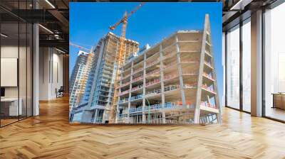 New building under construction on a bright winter day Wall mural