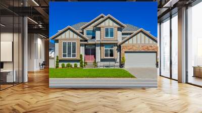 Suburban family house with green lawn in front Wall mural