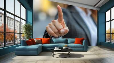 Businesswoman s hand with a victory gesture, close-up, symbolizing success, no face shown Wall mural