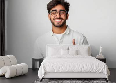 Young indian businessman wearing elegant shirt standing over isolated white background smiling with happy face looking and pointing to the side with thumb, Generative AI Wall mural