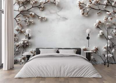 An elegant design featuring delicate snow-covered branches along the sides of a light gray background Wall mural