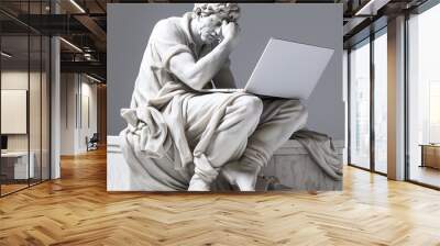 Statue of a man sitting and doing computer work.  Wall mural