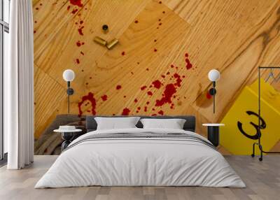 Bullets, bloody clothes and gun at crime scene Wall mural