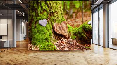 Funeral Heart sympathy. funeral heart near a tree. Natural burial grave in the forest. Heart on grass or moss. tree burial, cemetery and All Saints Day concepts	 Wall mural