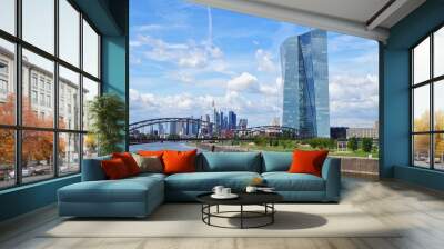 view of the river Main with the headquarters of ECB and the skyline of Frankfurt. European Central Bank and Skyscraper buildings in Germany with blue sky background. Business and finance concept Wall mural