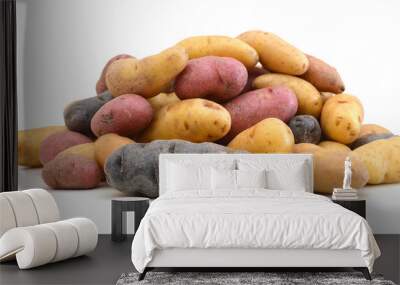 Fresh colorful potatoes red white blue on white background Wall mural