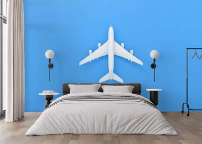 white plane on blue background. travel by plane vacation summer weekend sea adventure trip journey t Wall mural