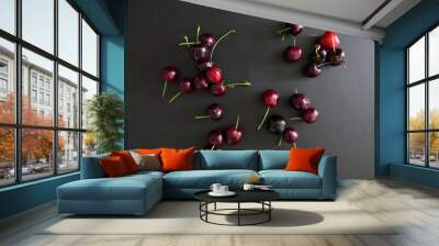 Fresh juicy Dark Red Cherries on a Black Background Wall mural