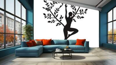 A woman is doing yoga in front of a tree Wall mural