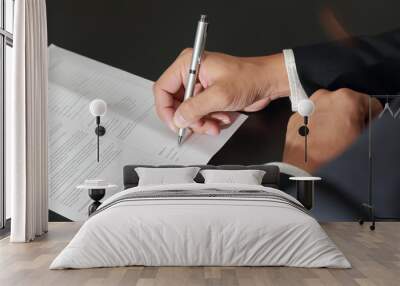 Approve or Sign contract, Businessman's Hand holding a pen signing to the document Wall mural