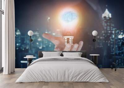 Light bulb with brain inside the hand of the businessman as business idea concept. Wall mural