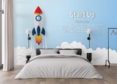 Rocket launch on the clouds and blue sky as paper art, craft style and business Startup project concept. flat design vector illustration. Wall mural