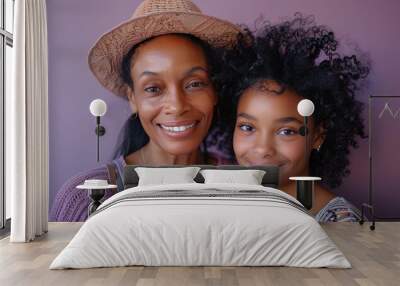 A joyful moment shared between a mother and her daughter, celebrating Mother's Day with bright smiles against a purple background Wall mural