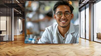 a multiracial man in glasses smiling confidently for the camera Wall mural