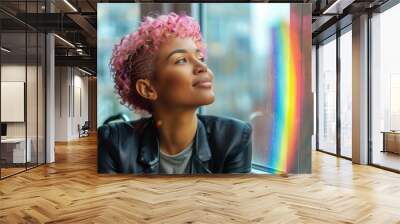 A woman with pink hair is looking out the window at a rainbow. Scene is peaceful and serene, as the woman takes in the beauty of the rainbow Wall mural