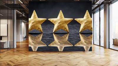 Three gold stars are reflected in a mirror. The stars are shiny and stand out against the dark background Wall mural