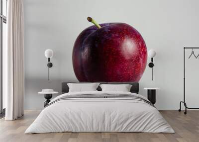 A whole plum isolated a white background Wall mural