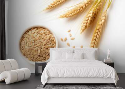 Organic peeled spelt grains and ear of wheat Wall mural