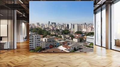 Beautiful view of São Paulo city skyline, avenues, houses and downtown business buildings in the background on sunny summer day with blue sky. Concept of urban, travel, latin america, tourism. Wall mural