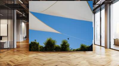 awnings for the sun in the yard of the house Wall mural