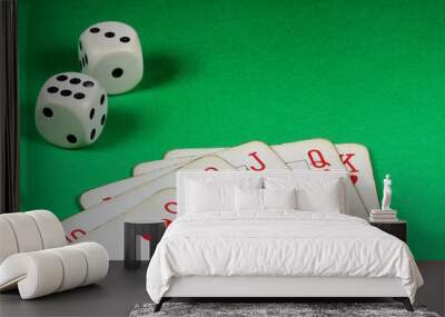 Poker cards and bone dice on green background. Wall mural