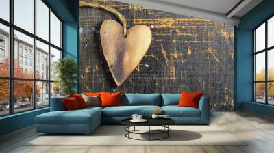 Wooden heart on scratched wooden table. Love concept. Wall mural