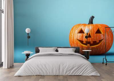 An unlit Halloween Jack O Lantern isolated on a widescreen pale blue background Wall mural