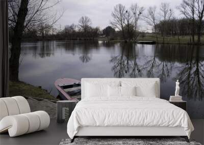 Rural landscape. Spring. Lake view with a boat Wall mural