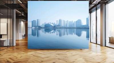 A city skyline of futuristic buildings along the river. Wall mural