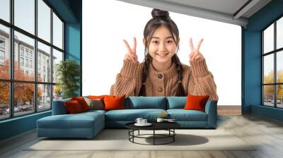 Confident Asian teenage girl showing something sitting at the table isolated on transparent background	
 Wall mural