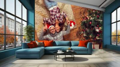 Couple spending Christmas day at home Wall mural