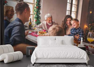 Family gathered for Christmas dinner Wall mural