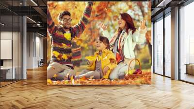 Family throwing autumn leaves Wall mural