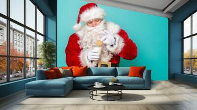 Santa eating cookies and drinking milk Wall mural