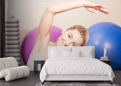 Happy woman stretching Wall mural