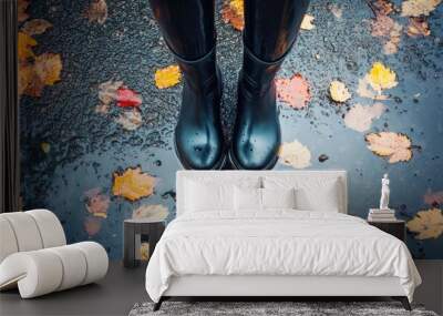 umbrella and black rubber boots in puddles. Wet asphalt road outdoors. Rainy season. Summer or fall day Wall mural