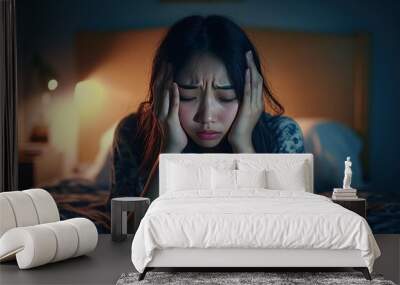 Annoyed, stressed, anxiety asian young woman suffering from insomnia, frustrated awake on bed at night, headache or migraine, health care problem, disturbed trouble of loud noise, unable sleepless, ai Wall mural