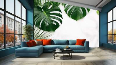 Isolate Dark green Monstera large leaves, philodendron tropical foliage plant growing in wild on white mable rock background concept for flat lay summer greenery leaf With generative ai Wall mural