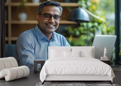 Smiling mature business man executive wearing shirt sitting at desk using laptop. Happy busy professional middle aged Indian businessman investor working on computer looking away in office, ai Wall mural