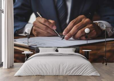 Close-up of a Man's Hand Signing a Document with a Pen Wall mural